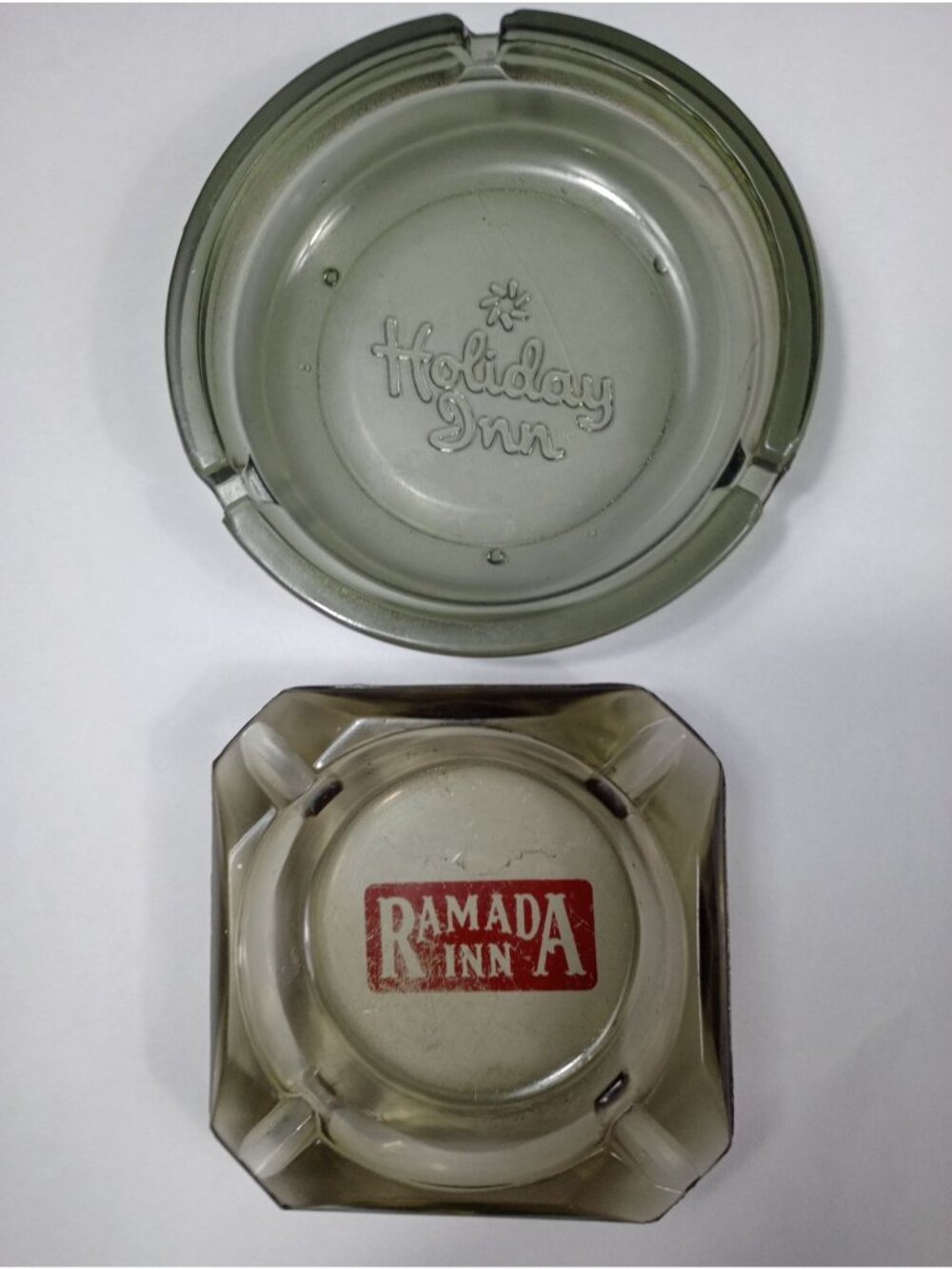 Vintage 2  pc Lot of Advertising ashtrays, Holiday Inn Smokey Round Glass and Ra